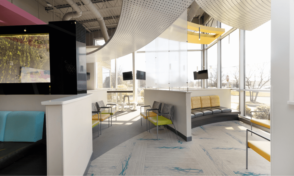 Modern waiting lounge with curved seating and large windows at the Spark Orthodontics Bethlehem, PA office