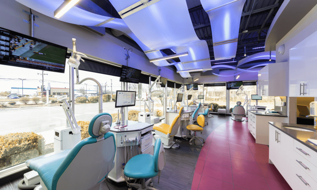 Open treatment bay with colorful LED ceiling lighting at the Spark Orthodontics Bethlehem, PA office