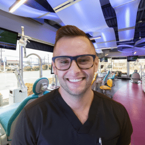 Dr. Brandon Smith smiling in the treatment area at Spark Orthodontics