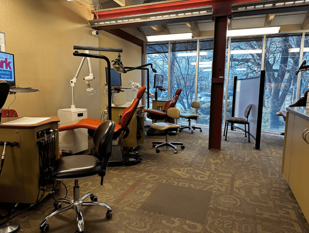 Treatment area with dental chairs beside large windows at the Spark Orthodontics Camp Hill, PA office