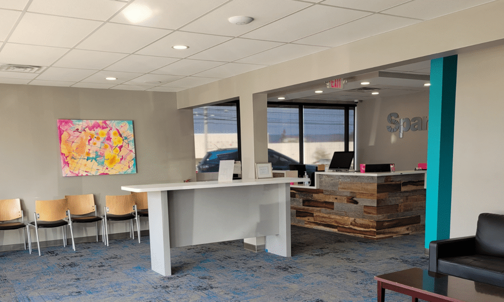 Waiting area with seating and reception desk at the Spark Orthodontics Harrisburg, PA office