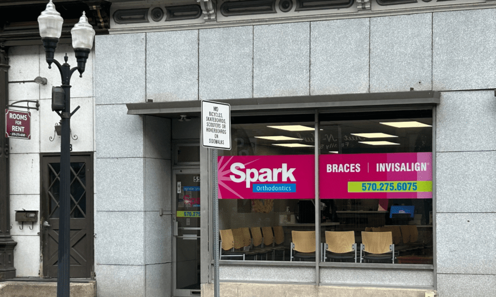Storefront window with Spark Orthodontics signage at the Danville, PA office