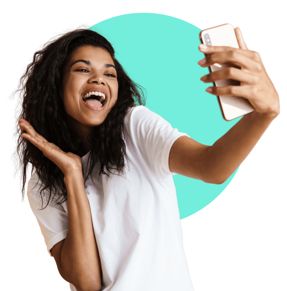 Woman taking a selfie to try Invisalign smile preview