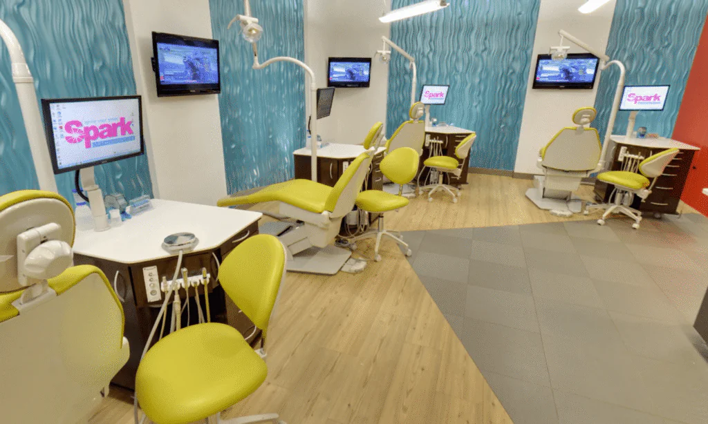 Open treatment bay with yellow dental chairs at the Spark Orthodontics Reading, PA office