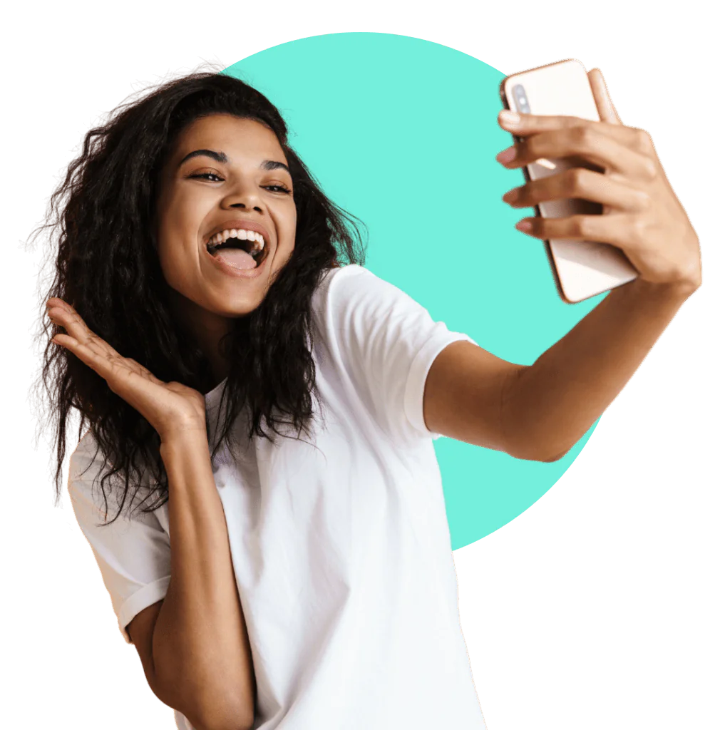 Woman taking a selfie to try Invisalign smile preview